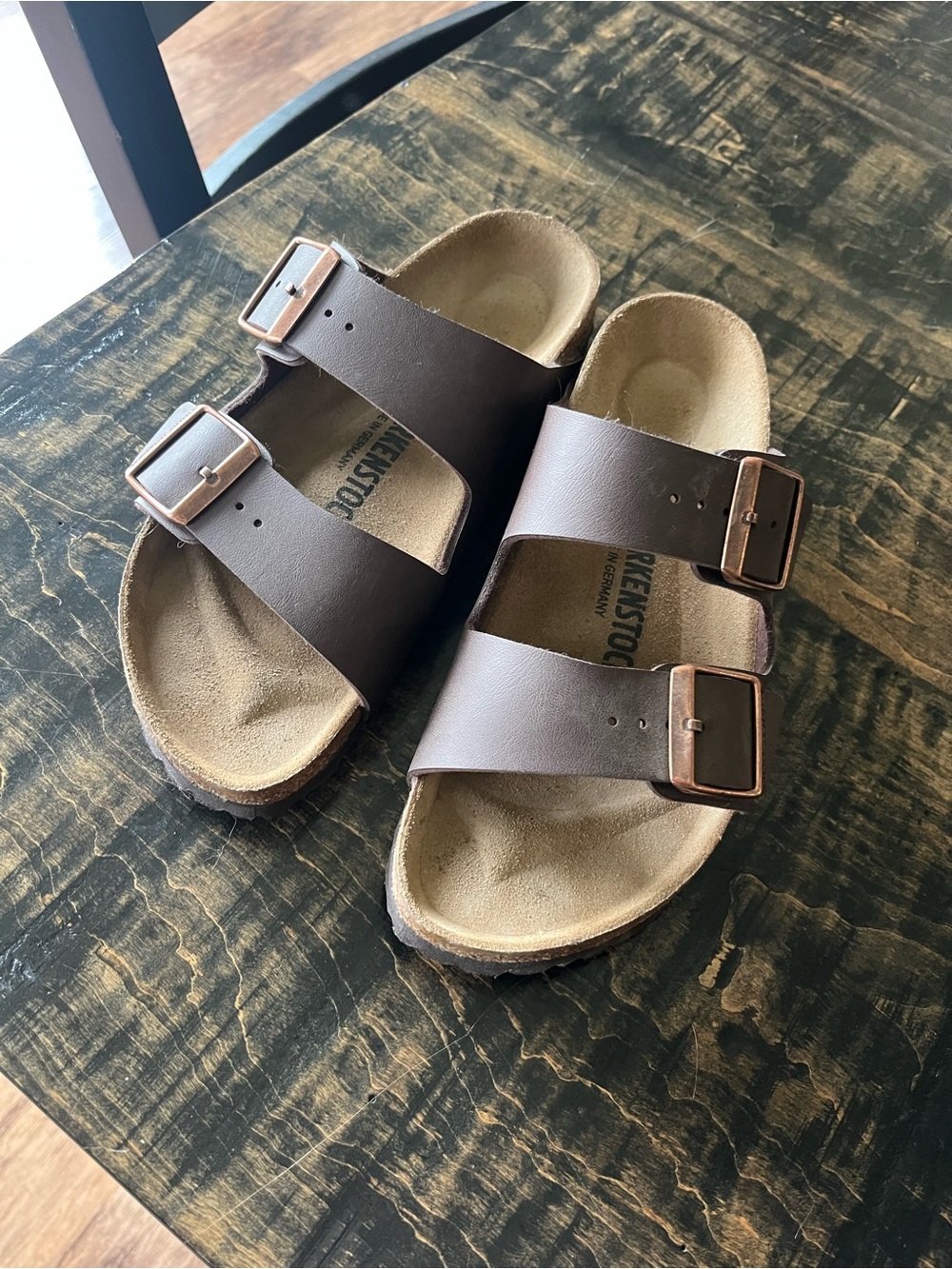 Birkenstock Arizona Two-Strap Sandals in Dark Brown with Copper Buckles